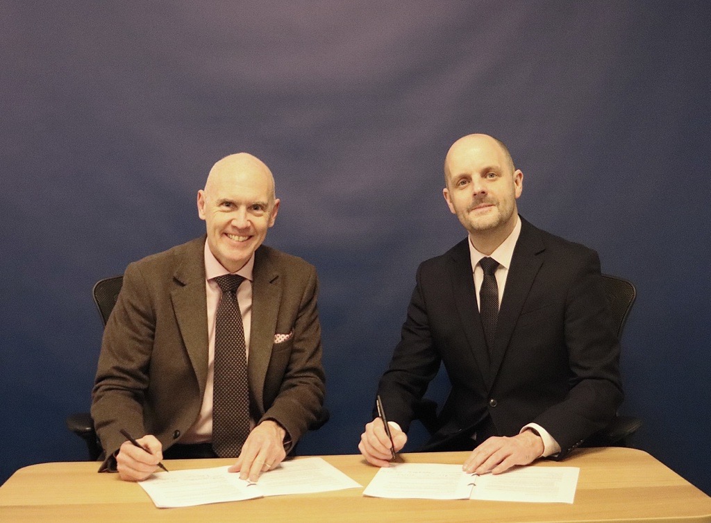 Director general Marco Forgione signing MoU with Matt Gantley, the chief executive of the UK Accreditation Service 