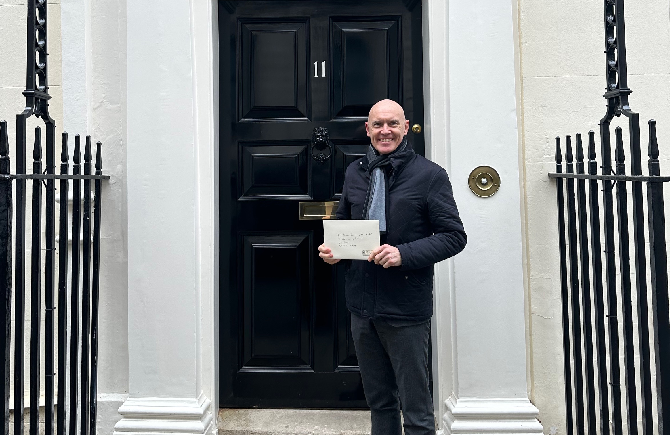 Marco Forgione at no 11 Downing Street handing over a letter