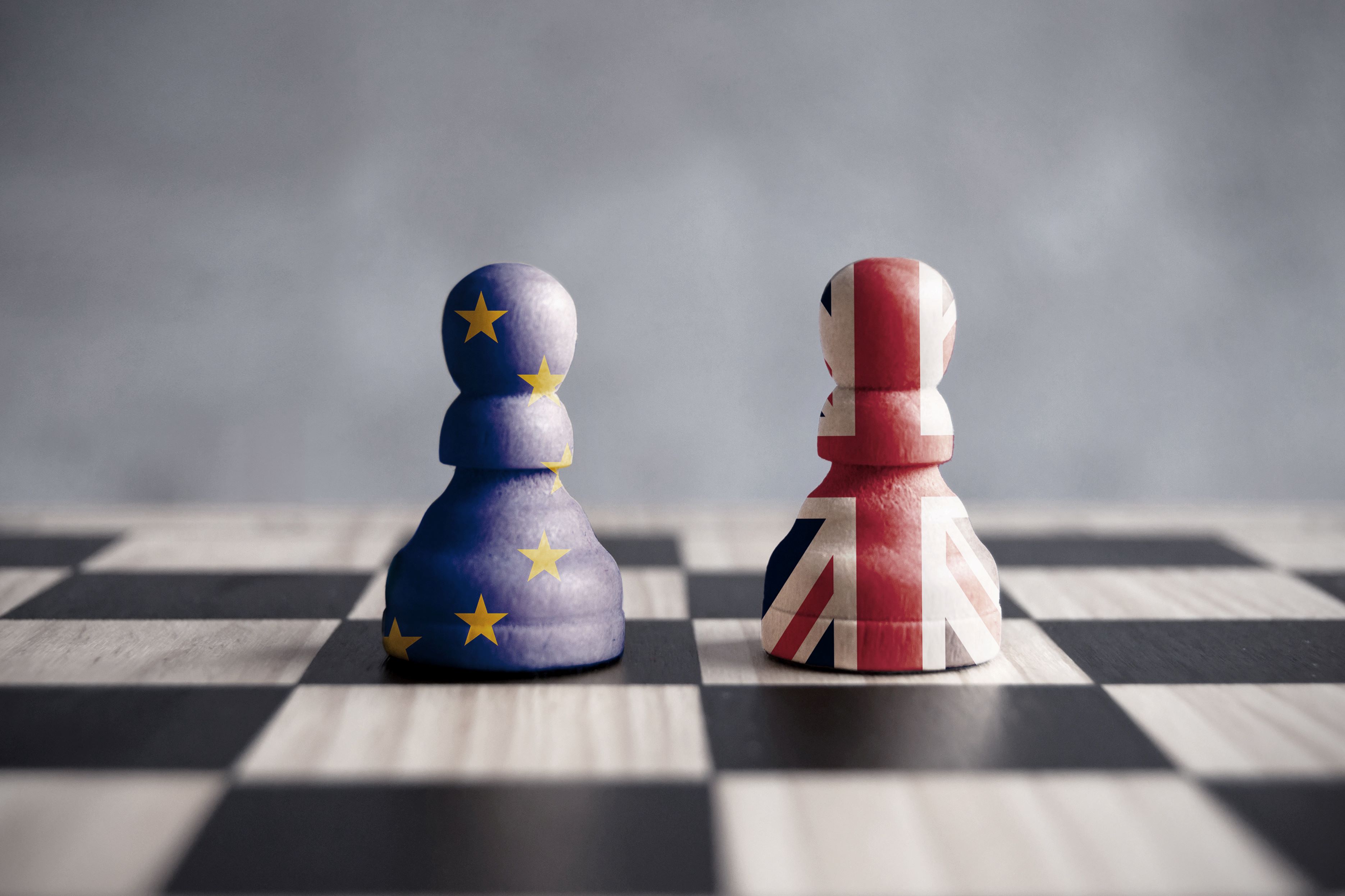 EU and UK flag-coated chess pieces