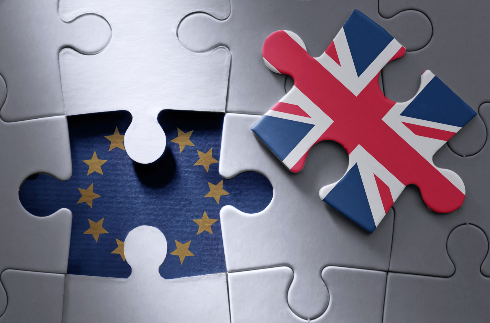 image of jigsaw puzzle wih EU flag and Union Jack flag pieces